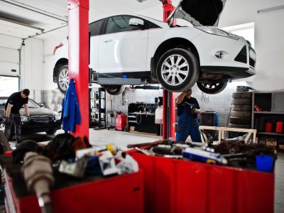 car-repair-maintenance-theme-mechanic-uniform-working-auto-service_627829-3918